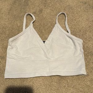Cropped tank top in color light blue, Brandy Melville. Size small.